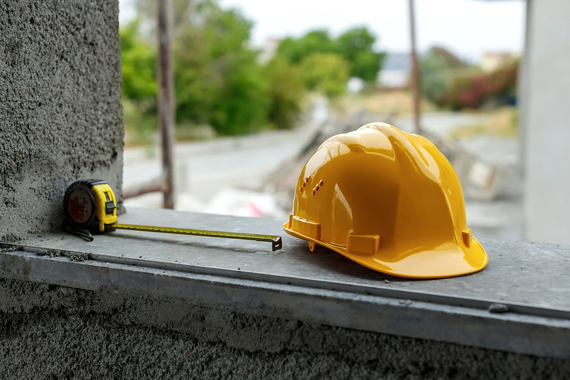 A yellow hard hat and a meter