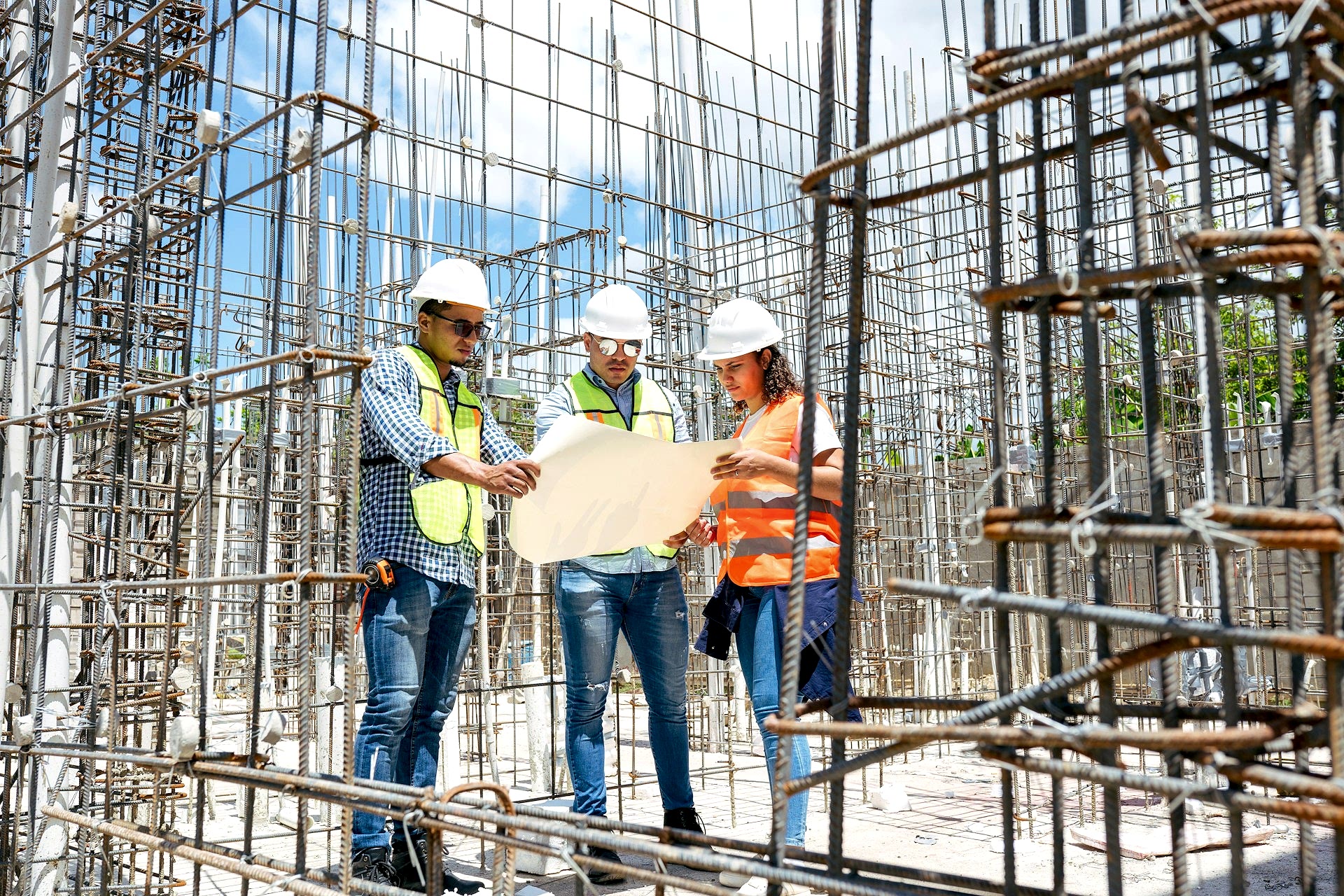 Three people wearing white hard hat