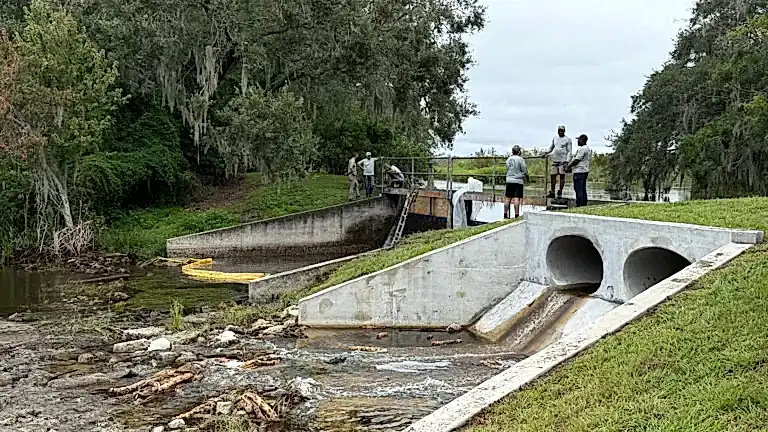 commercial-damwideshot Wide view of Lake Lulu dam, spillway, and culvert system in Winter Haven, FL during soil stabilization and repair project.