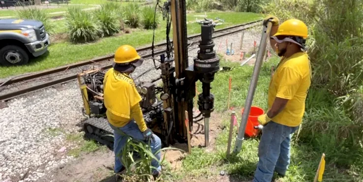 commercial-underpinninghelicals-buschgardens Helicon crew members completing the underpinning process with helical piers at Busch Gardens in Tampa, Florida.