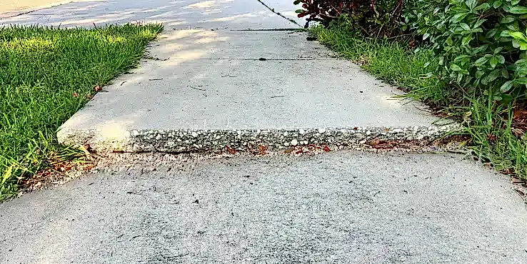 2.1Concrete Repair 1 - Sunken Sidewalk A sunken sidewalk