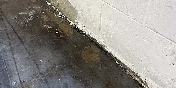 commercial-gapinfloorstabilization Filling gap in between floor with polyurethane foam.
